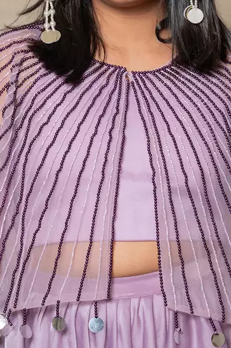 Elegant lavender ensemble with a beaded cape and layered skirt