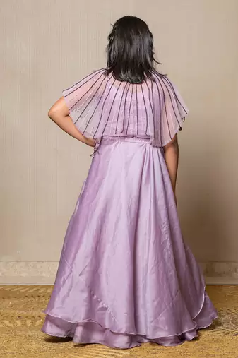 Elegant lavender ensemble with a beaded cape and layered skirt