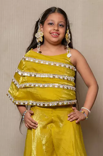 Vibrant golden-yellow ensemble with an asymmetrical top and wide-legged pants