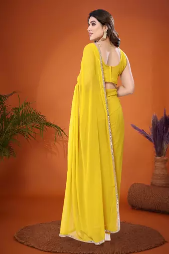 Yellow embellished pure georgette  saree with blouse piece