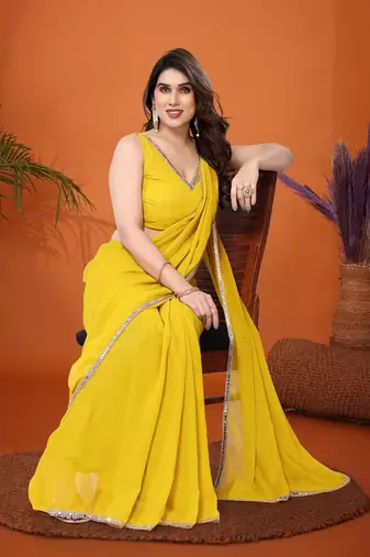 Yellow embellished pure georgette  saree with blouse piece