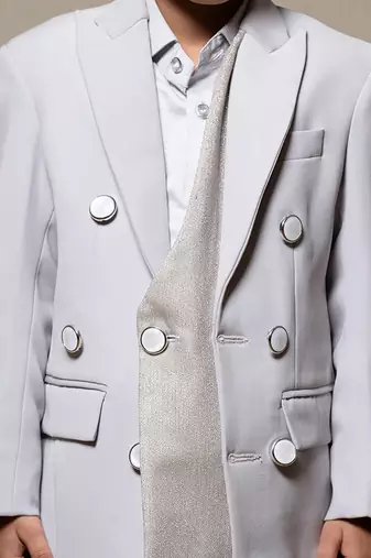 Stylish light grey double-breasted suit with silver accents
