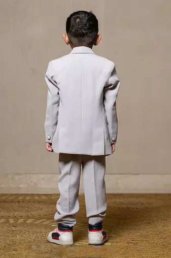 Stylish light grey double-breasted suit with silver accents