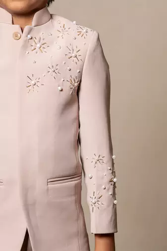 Classy beige suit with delicate floral embroidery and pearl accents