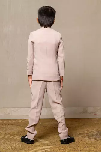 Classy beige suit with delicate floral embroidery and pearl accents