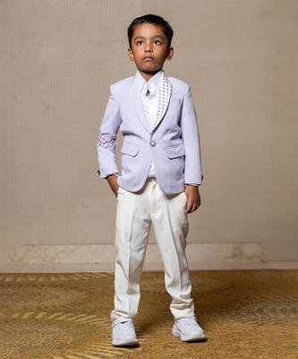 Trendy lavender blazer with metallic stud embellishments paired with classic white trousers 1