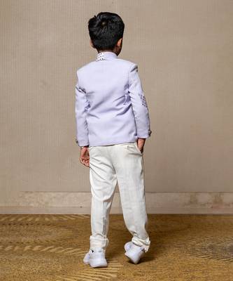 Trendy lavender blazer with metallic stud embellishments paired with classic white trousers 2