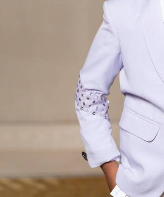 Trendy lavender blazer with metallic stud embellishments paired with classic white trousers 5