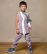 Stylish sleeveless lavender blazer with a modern asymmetrical white lapel, paired with matching slim-fit trousers