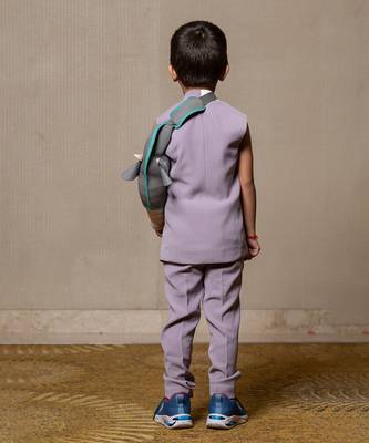 Stylish sleeveless lavender blazer with a modern asymmetrical white lapel, paired with matching slim-fit trousers 3
