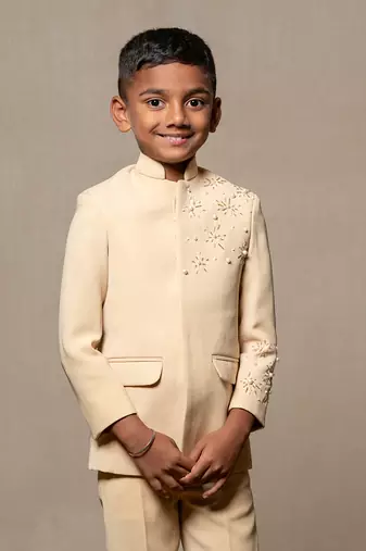 Elegant light beige bandhgala suit with delicate floral embroidery