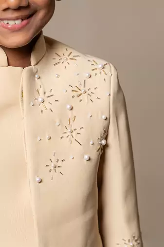 Elegant light beige bandhgala suit with delicate floral embroidery