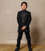 Modern blacksuit with embroidered gold accents and a high mandarin collar