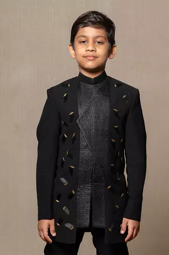 Modern blacksuit with embroidered gold accents and a high mandarin collar