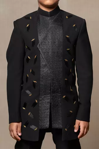 Modern blacksuit with embroidered gold accents and a high mandarin collar