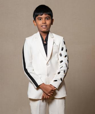 Modern off-white suit with blackaccents and stylish embroidered sleeve detail 1