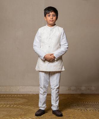 Ivory embroidered nehru jacket paired with a classic white shirt and pants 1