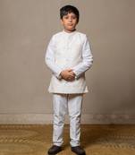 Ivory embroidered nehru jacket paired with a classic white shirt and pants
