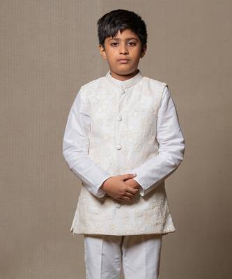 Ivory embroidered nehru jacket paired with a classic white shirt and pants 2