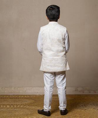 Ivory embroidered nehru jacket paired with a classic white shirt and pants 3