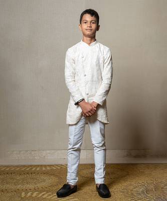 Intricately embroidered off-white bandhgala with matching white kurta and pants 1