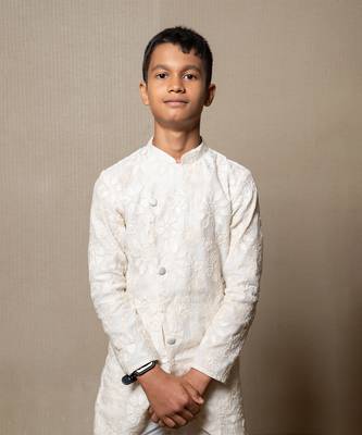 Intricately embroidered off-white bandhgala with matching white kurta and pants 2
