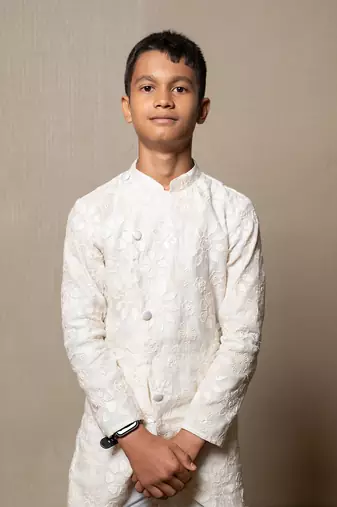 Intricately embroidered off-white bandhgala with matching white kurta and pants