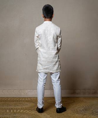 Intricately embroidered off-white bandhgala with matching white kurta and pants 4
