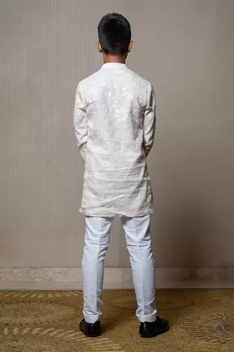 Intricately embroidered off-white bandhgala with matching white kurta and pants