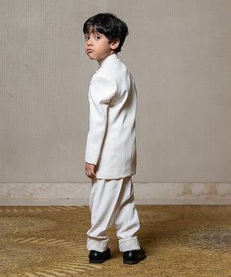 Ivory white bandhgala jacket with intricate pearl and sequin embellishments paired with matching straight-fit pants 2