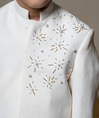 Ivory white bandhgala jacket with intricate pearl and sequin embellishments paired with matching straight-fit pants 3