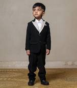 Classic black blazer with a champagne metallic-textured lapel, paired with matching pants and a crisp white shirt