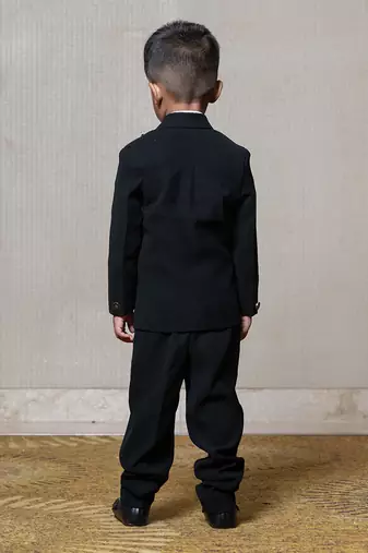 Classic black blazer with a champagne metallic-textured lapel, paired with matching pants and a crisp white shirt