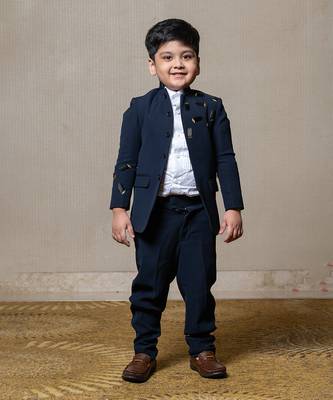 Navy blue blazer with elegant metallic embroidery, paired with matching trousers and a crisp white shirt 1