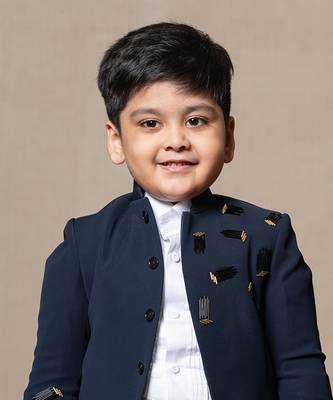 Navy blue blazer with elegant metallic embroidery, paired with matching trousers and a crisp white shirt 2