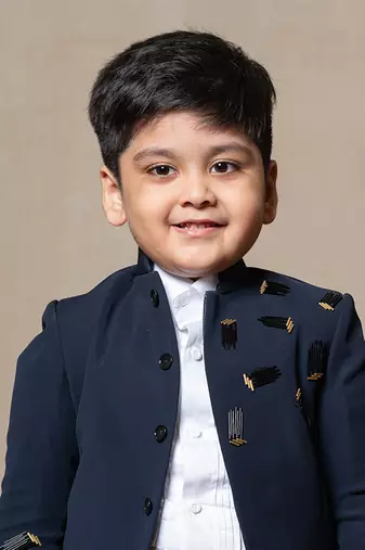 Navy blue blazer with elegant metallic embroidery, paired with matching trousers and a crisp white shirt