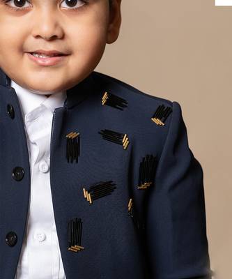 Navy blue blazer with elegant metallic embroidery, paired with matching trousers and a crisp white shirt 3