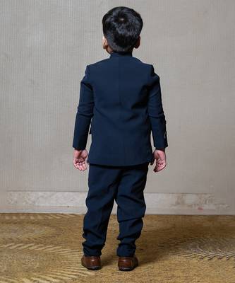 Navy blue blazer with elegant metallic embroidery, paired with matching trousers and a crisp white shirt 4