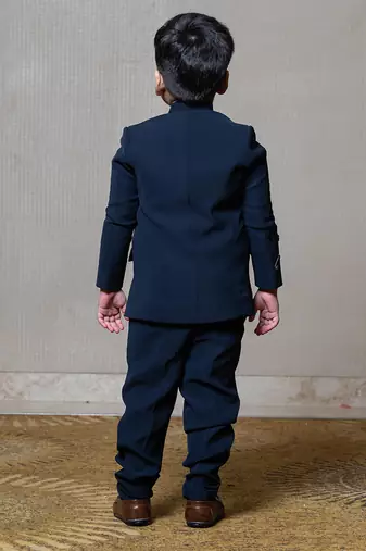 Navy blue blazer with elegant metallic embroidery, paired with matching trousers and a crisp white shirt