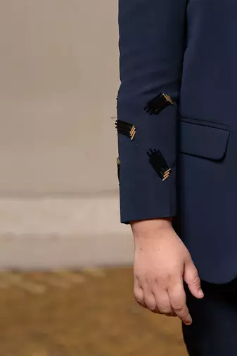 Navy blue blazer with elegant metallic embroidery, paired with matching trousers and a crisp white shirt