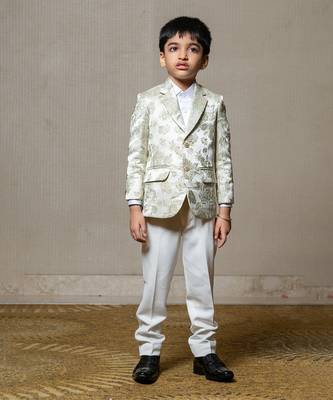 Elegant cream blazer with intricate green floral embroidery, paired with matching trousers and a crisp white shirt 1