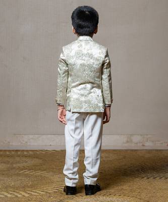 Elegant cream blazer with intricate green floral embroidery, paired with matching trousers and a crisp white shirt 4