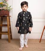 Elegant black kurta with floral embroidery paired with classic white churidar pants