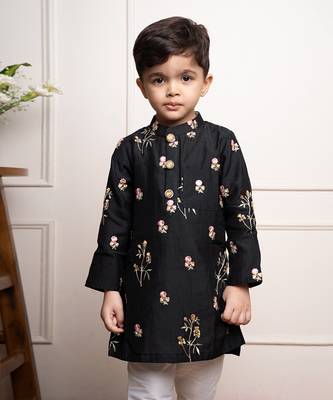 Elegant black kurta with floral embroidery paired with classic white churidar pants 2