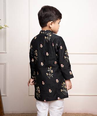 Elegant black kurta with floral embroidery paired with classic white churidar pants 3