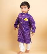 Vibrant purple kurta with golden motifs and yellow pocket square, paired with classic white churidar pants