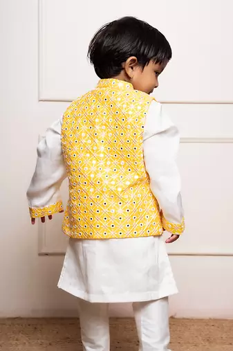 Elegant white kurta set with a vibrant yellow mirror-work nehru jacket