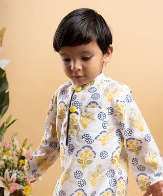 Vibrant floral printed kurta paired with classic white pants 2