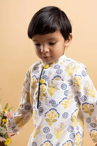 Vibrant floral printed kurta paired with classic white pants