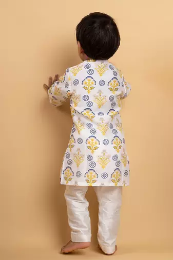 Vibrant floral printed kurta paired with classic white pants